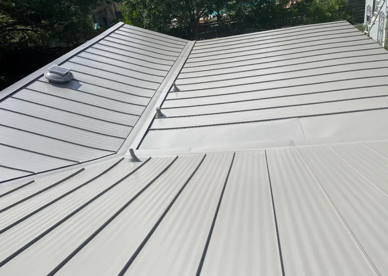 Solar attic fan installed on a metal roof for Roof Ventilation in Minnehaha